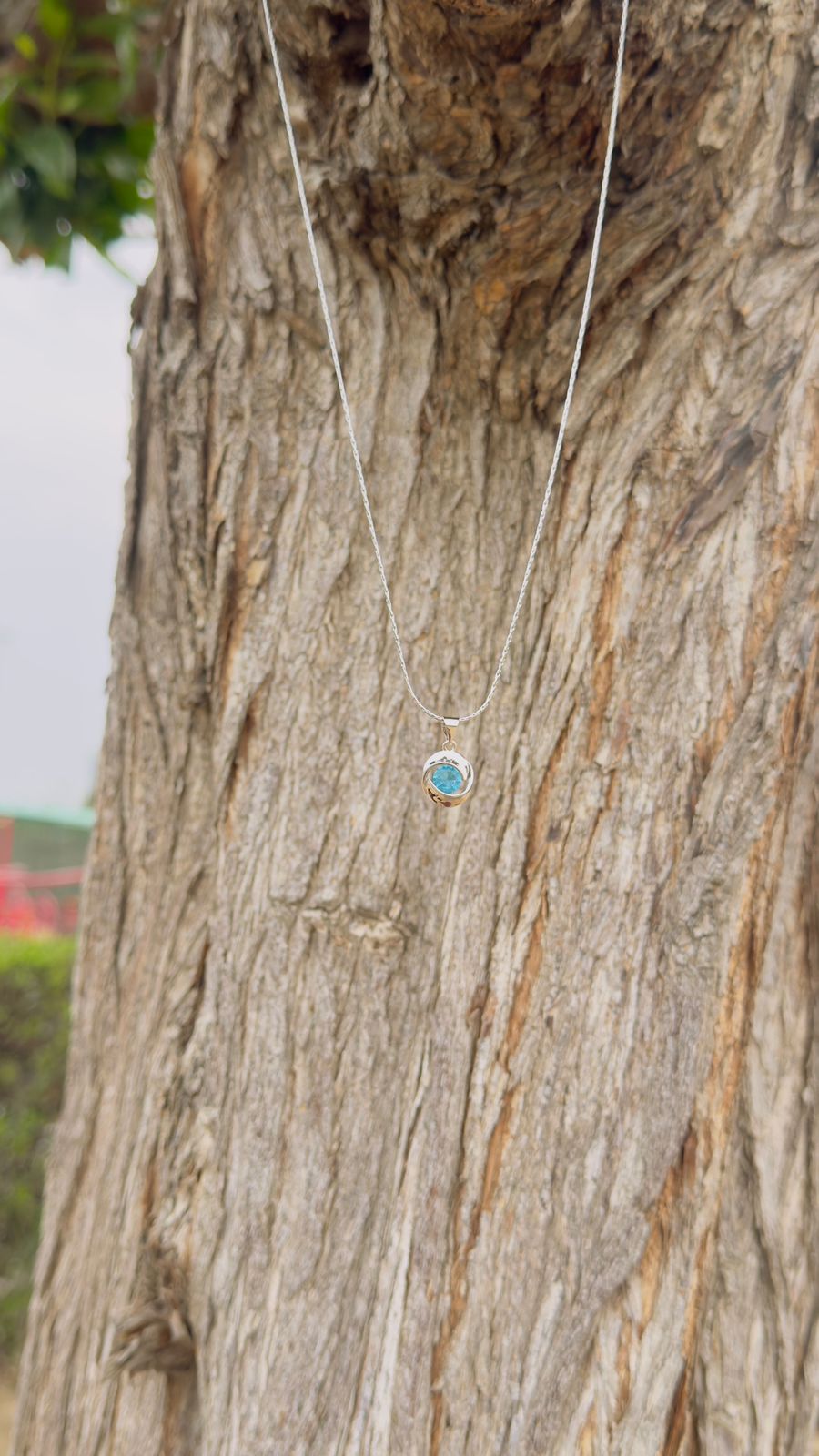 Blue Emerald Love Knot Pendant
